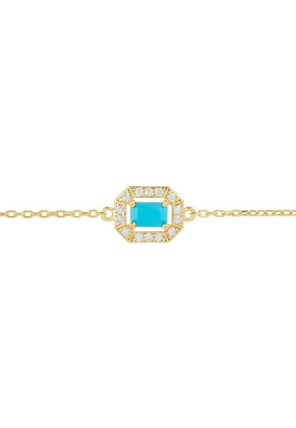 Gold bracelet with a turquoise stone and diamond accents on a white background