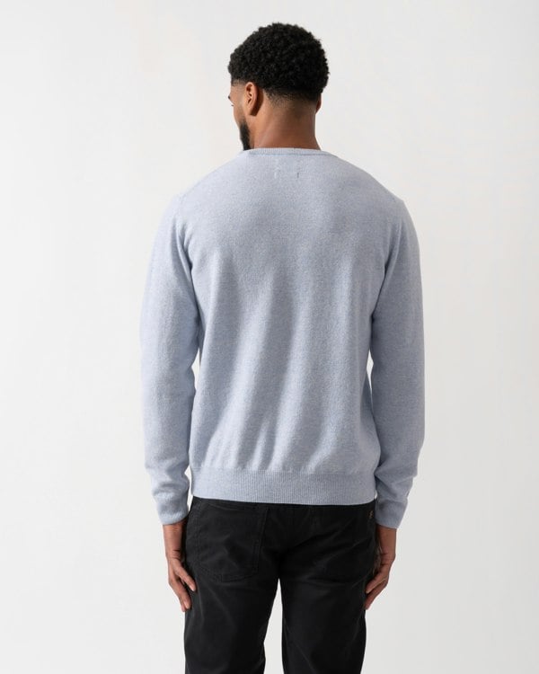 back shot of a model wearing a GANT Mens Superfine Lambswool Crew Neck Jumper in Ice Blue Melange