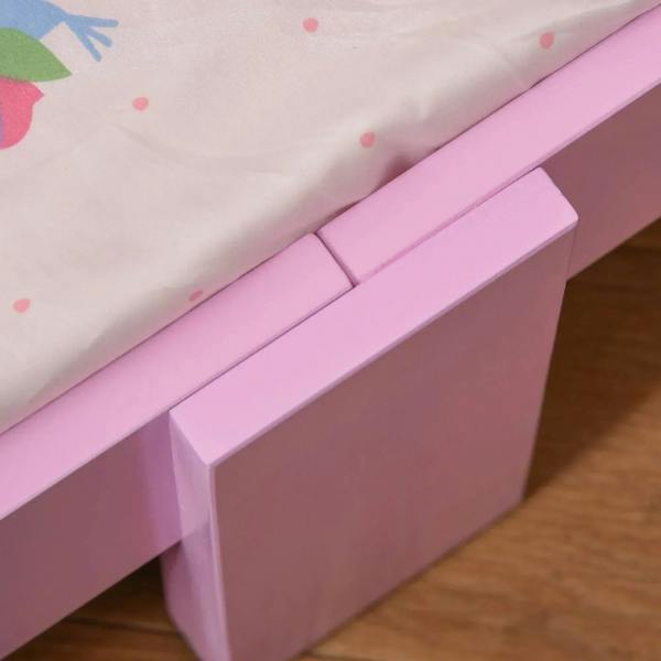 Close-up of pink side rail with fitted mattress edge and rounded corner design