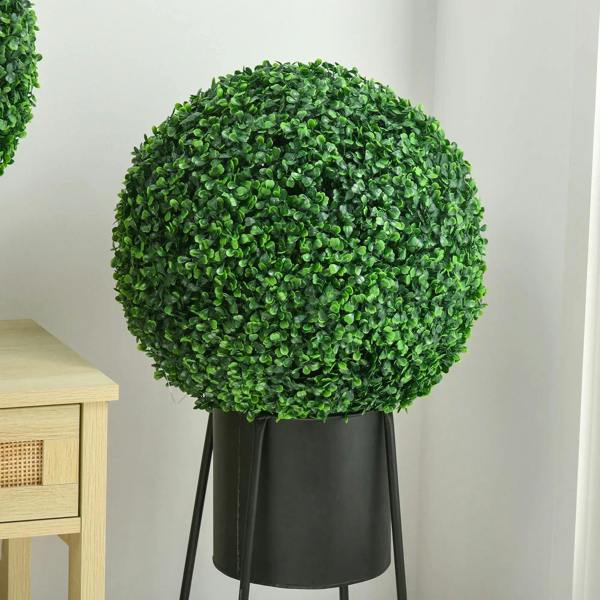 Green artificial boxwood topiary ball on black pot and metal stand