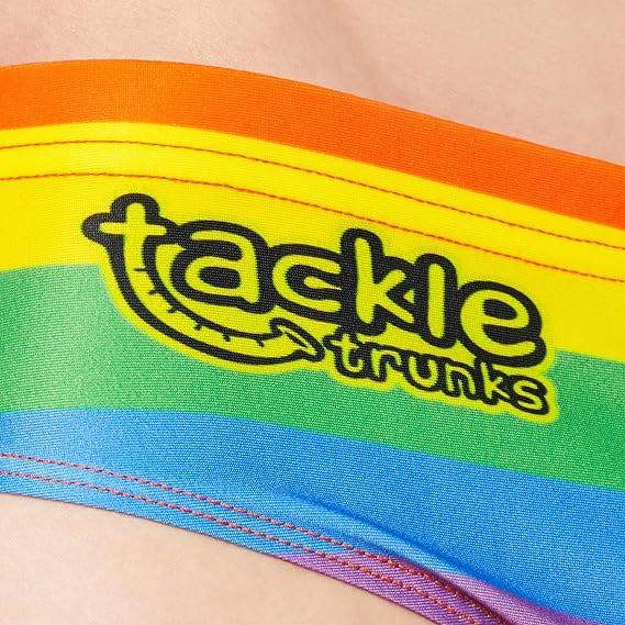 Optimum Tackle Trunks swim brief, close-up of tackle trunks logo on rainbow stripe waistband - Optimum