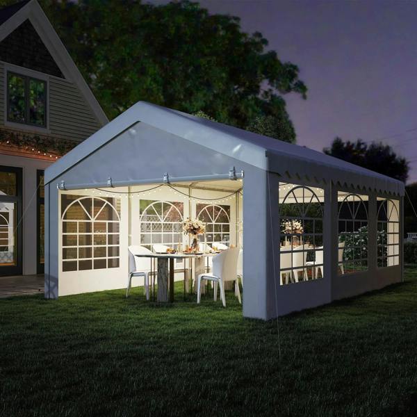 White outdoor party gazebo with window panels and open entry for dining setup