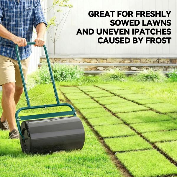 Black drum lawn roller with dark green handle for leveling freshly seeded grass