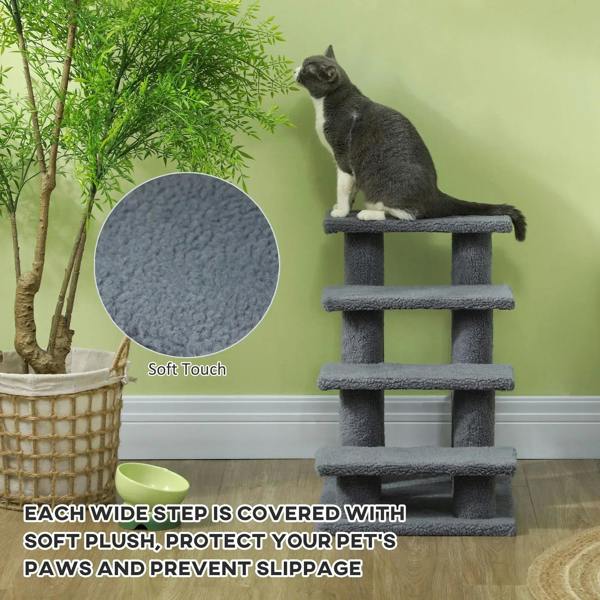 Grey plush pet stairs with platforms and rail-style posts supporting a sitting cat