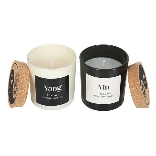 Two Yin-Yang candles with lids: white Yang coconut and black Yin Black Oud, unlit