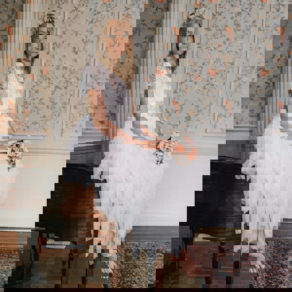 Girl wearing dress and holding flower bouquet