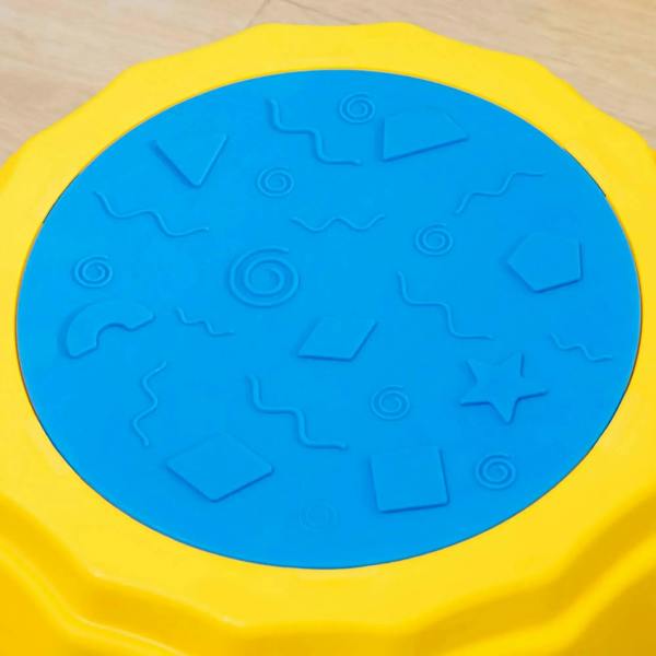 Close-up of yellow stepping stone top with blue textured non-slip tread pattern