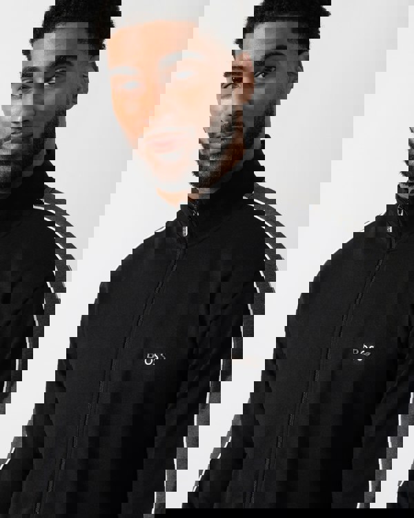 Close up shot of a Model wearing a BOSS Orange Mens Full Zip Loungewear Tracksuit Jacket in Black
