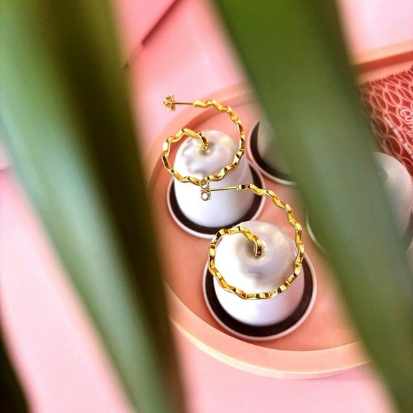 Spiral zig zag hoops by LENAE. Gold vermeil earrings designed in London, UK. Shop now.