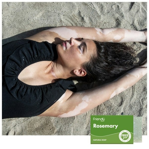 Woman stretching on sandy beach
