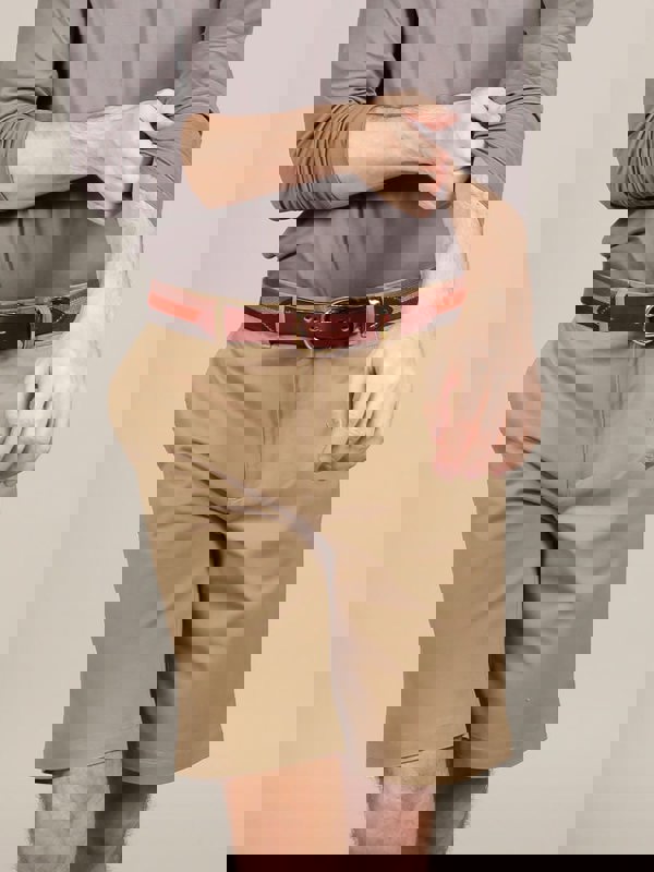 Model wearing canvas belt with chino shorts