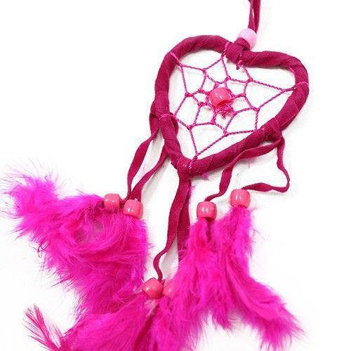 Pink heart dreamcatcher with web design and long pink feather fringe on a red cord.