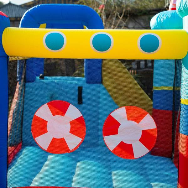 Inflatable bounce house entrance with blue mesh walls and red-and-white lifebuoy decals