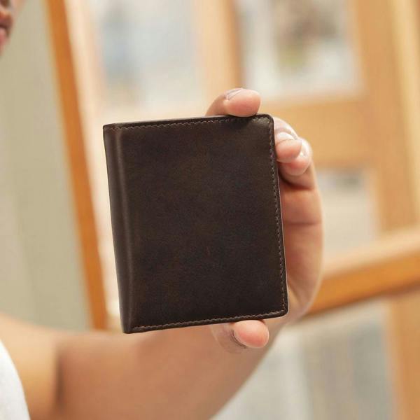 Person holding brown leather  wallet for men nico tuscan
