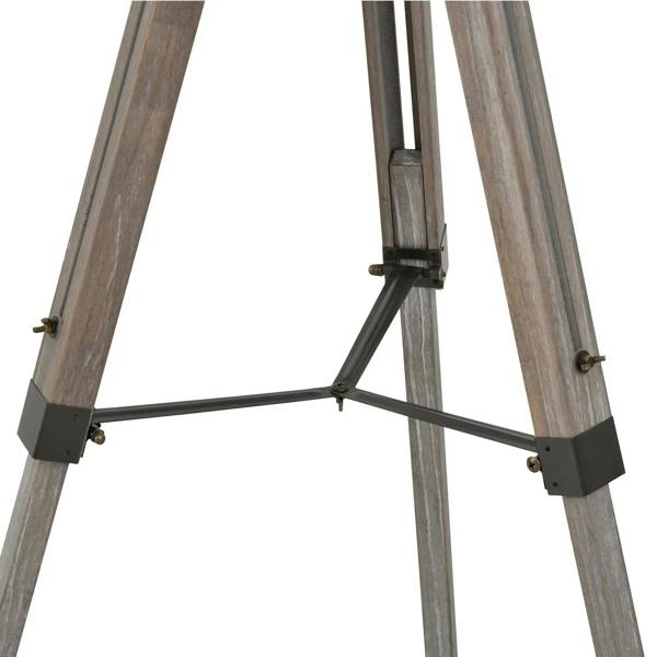 Adjustable tripod joint on grey floor lamp with wood legs and locking bar