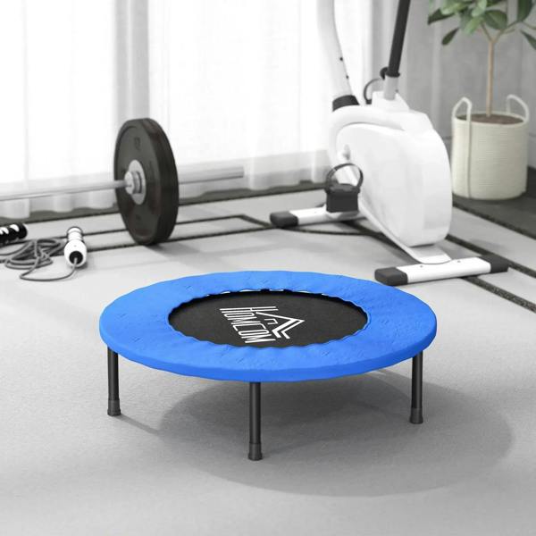 Blue mini trampoline with black safety pad and center jumping surface, four dark legs