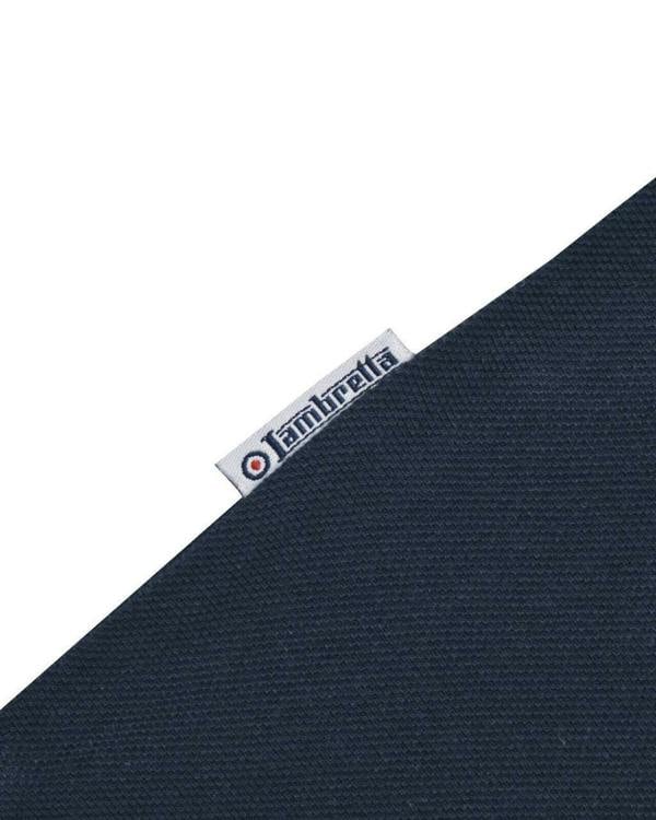 Lambretta Mens Vintage Classic Mod Ska Casual Smart Polo, close-up of the fabric showing textured navy material and a small brand label.