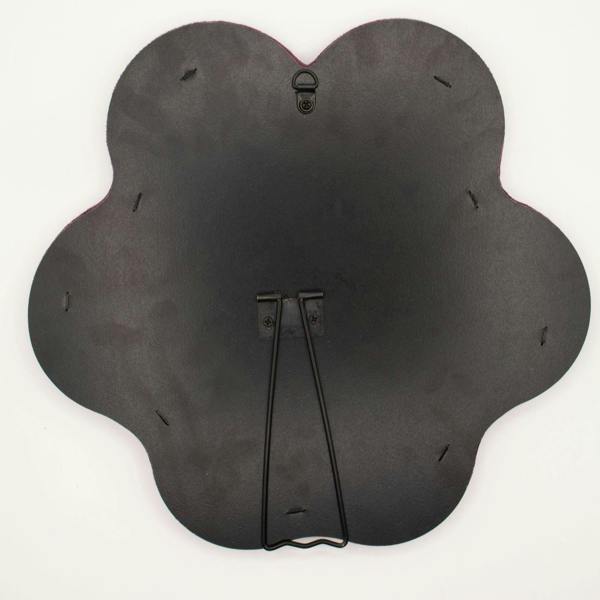 Star-shaped mirror back in dark fabric with hanging/stand mounts and small holes