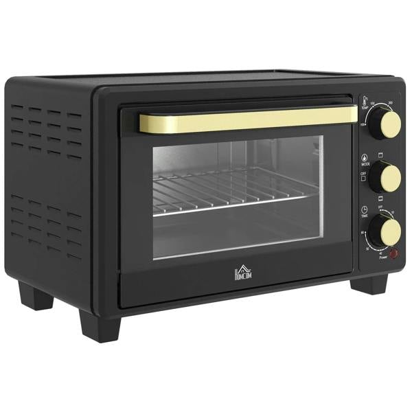 Black countertop toaster oven with glass door and gold control knobs