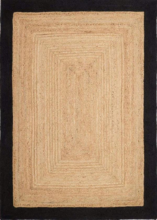Beige braided rug on a black background