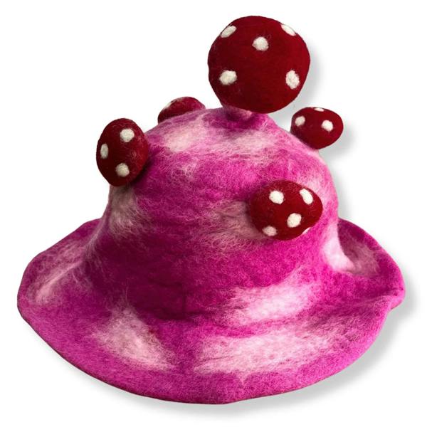 Bright pink felt mushroom hat with central red cap and white-spotted round accents