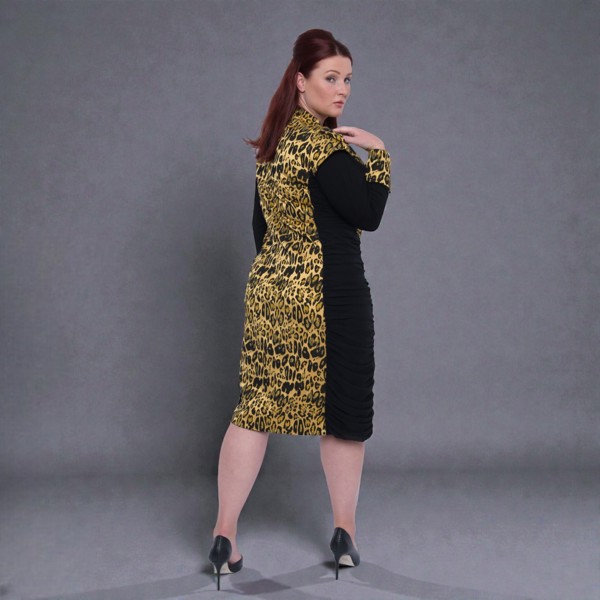 Women's Plus Size Black Gold Bodycon Midi Leopard Brocade Jacquard Dress styled with  black heels for an elegant, polished lookShown from the side. Plain Background.