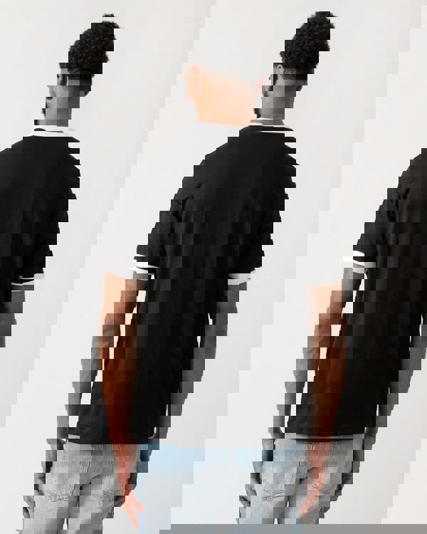 back of a model wearing a HUGO Doffice Mens T-Shirt in Black