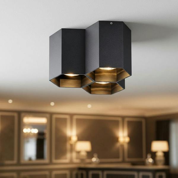 Black surface mounted ceiling spotlights in a modern hotel reception 