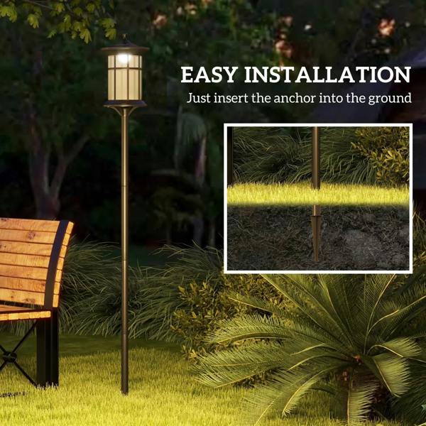 Black solar lamp post set with ground stake base for easy outdoor installation