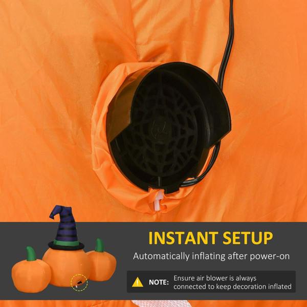 Orange inflatable pumpkin with witch hat and visible air blower hose opening