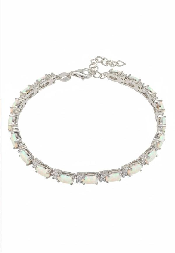 Silver bracelet with opal stones on a white background