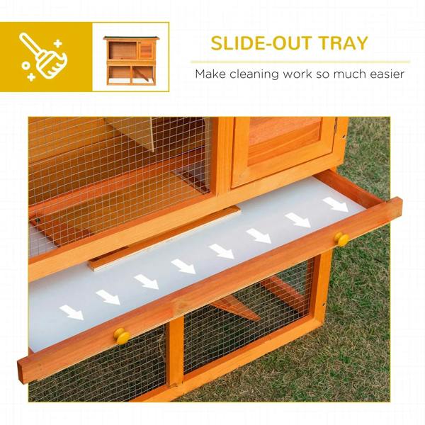 Two-tier wooden rabbit hutch with slide-out tray under the wire mesh compartments