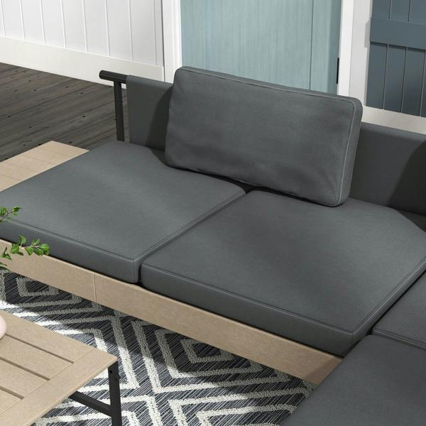 Grey L-shaped outdoor sofa with two seat cushions and a tall backrest cushion
