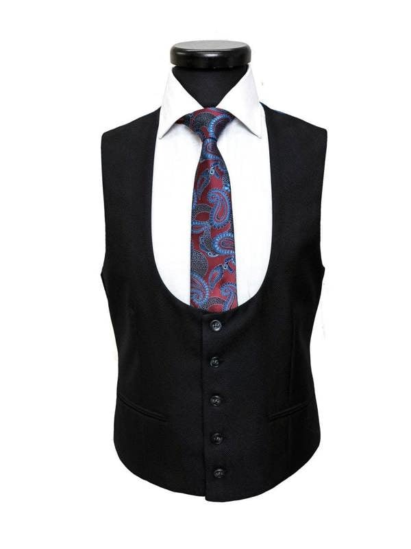 Black textured two-button slim fit suit by PAMONI, tailored with a modern design and sharp lapels, displayed on a hanger.