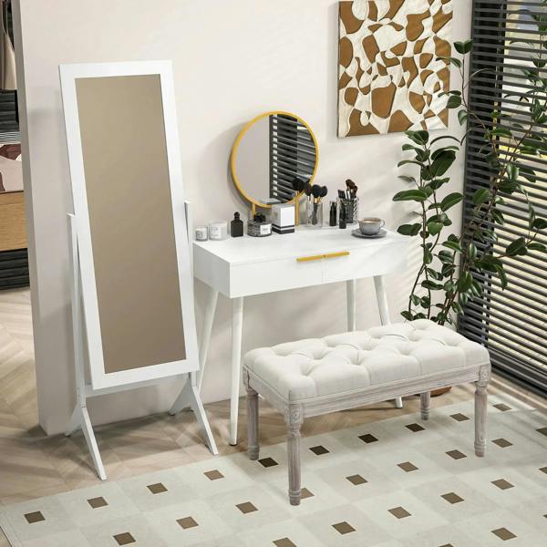 White dressing table with round mirror and gold handle, vanity items on countertop