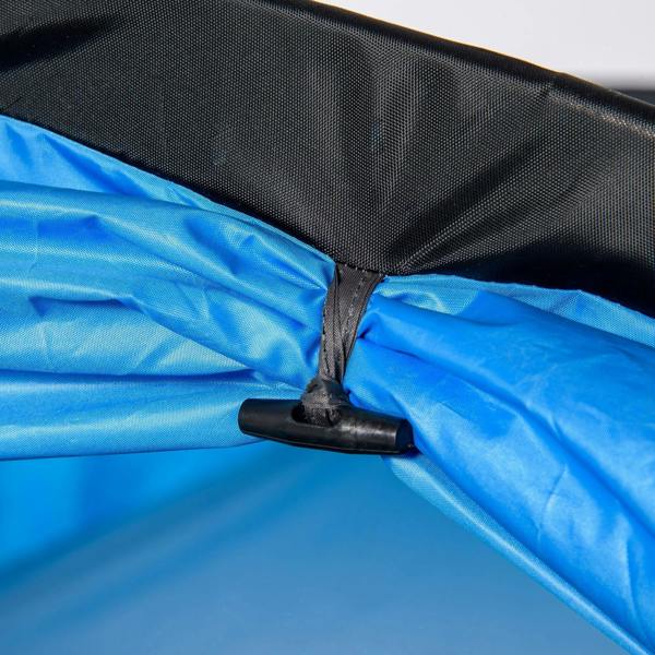 Blue tunnel tent fabric close-up with stake-and-strap anchor