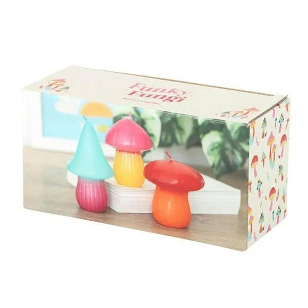 Set of 3 mushroom-shaped candles in a retail gift box with colorful mushroom artwork
