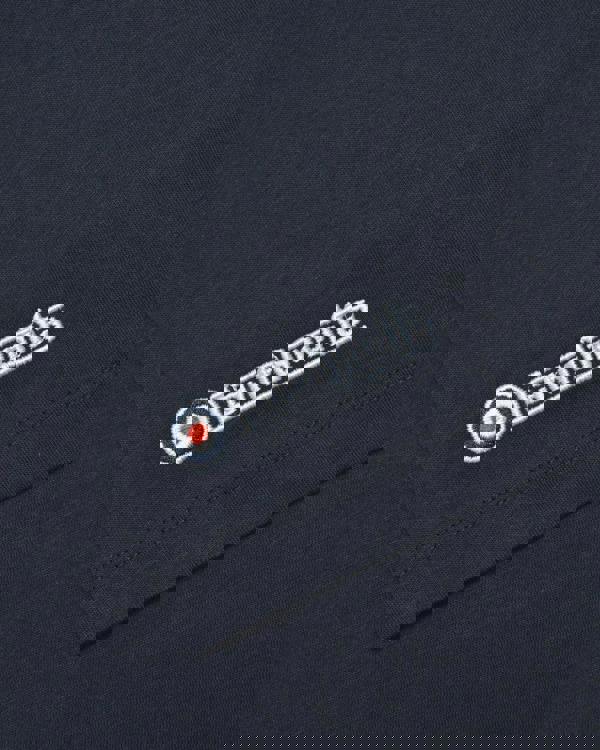 Lambretta Mens Scooter Logo Graphic Mod Ska Casual T-Shirts, close-up view of the black fabric with white embroidered Lambretta logo and target emblem.