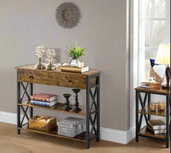 Rustic brown console table with black metal X-frame, drawer, and 3-tier open shelving in an industrial hallway setting

