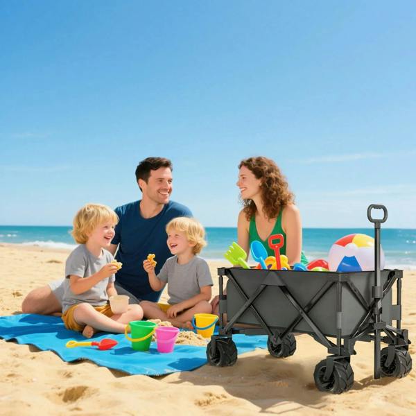 Dark grey folding pull-along cargo wagon trailer on beach with all-terrain wheels