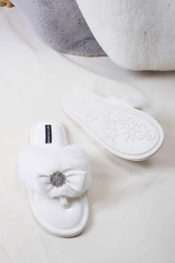 Amelie women's toe post slippers in cream with a premium velvet bow and diamante embellishment atop a plush faux fur band from Pretty You London