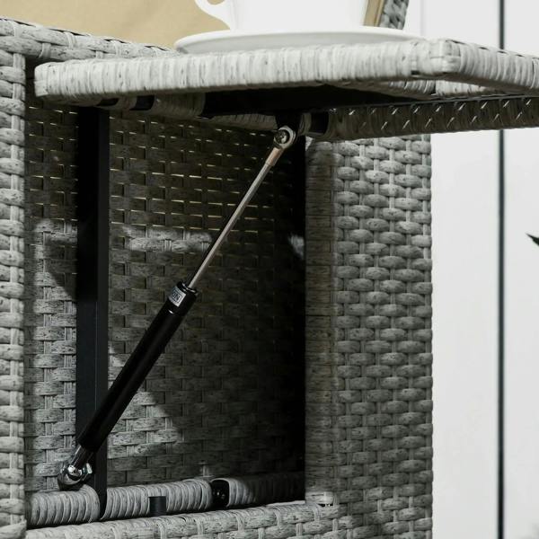 Rattan storage compartment with raised lid supported by metal strut