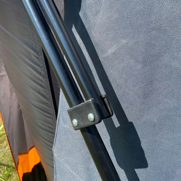 A closeup of the foldable arm of the Collapsible Camp Storage Cupboard from OLPRO.