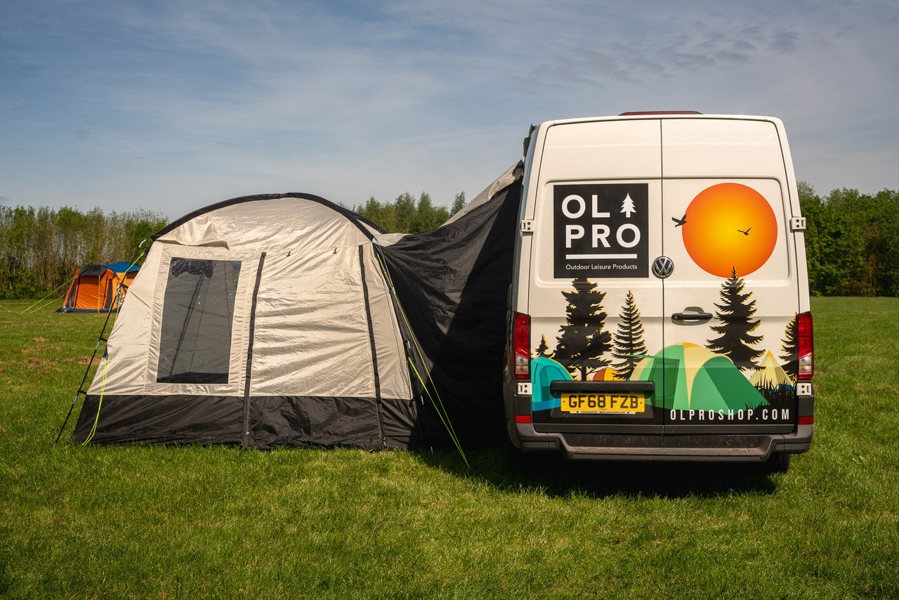 An image of the Cubo XL Motorhome Awning - Fibreglass Poles from OLPRO that is attached to a VW Crafter.