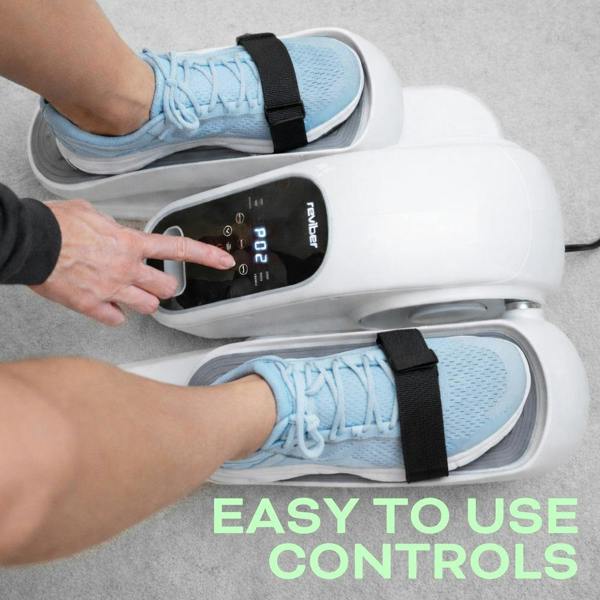 A person in blue sneakers uses the Reviber Motorised Mini Elliptical Bike by Reviber, pressing a button on its electronic display. Text: “EASY TO USE CONTROLS.” Perfect for seated, low-impact leg exercise on a light gray carpet.