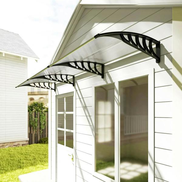 Clear front porch door awning with black frame and curved supports in installed position