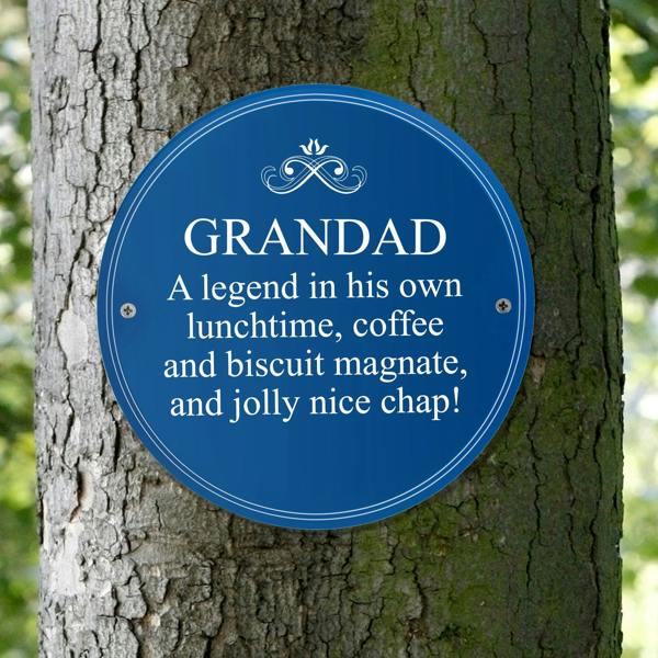 Circular blue personalised heritage plaque attached to a tree trunk featuring custom white text for Grandad