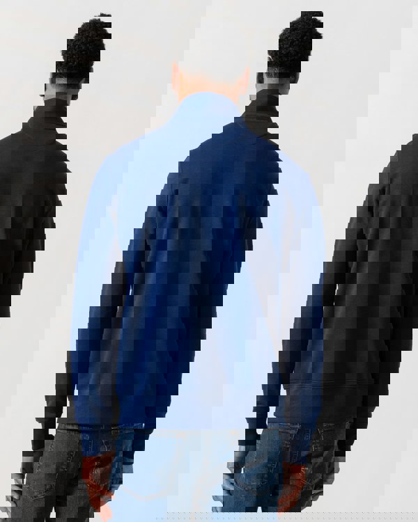 Model wearing GANT Mens Regular Fit Shield Logo Half Zip Sweatshirt in 432 Rich Navy - Back