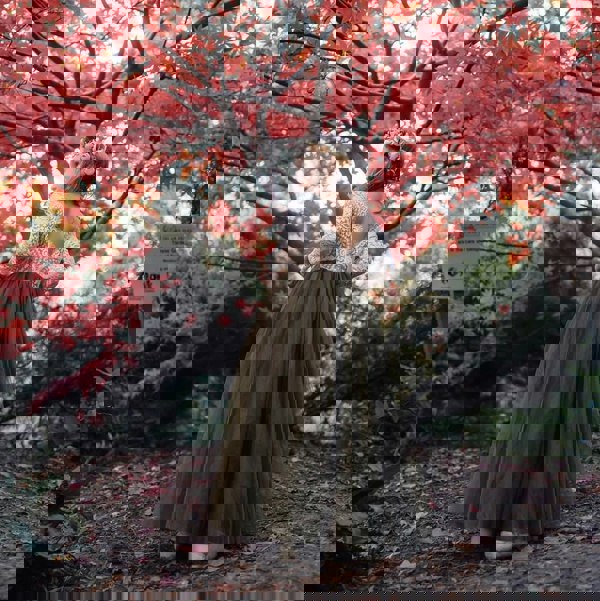 young flower girl stood under tree in a Baby Bohemian Classic Long Sleeve Dress 