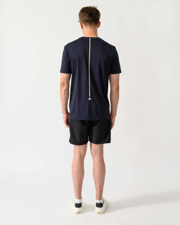 back shot of a model wearing a BOSS Green TOC Game Mens T-Shirt in Dark Blue 402